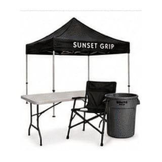 Sunset Grip pop-up tent with folding table, director chair and trash barrel